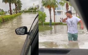 Auckland man Luca Bella (pictured) and his wife Dima Hamadeh were stranded in the Dubai floods, having to carry their young children to safety after their car filled up with water on the way to the airport.
