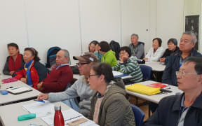 Lu Yafei and John Zhang in class
