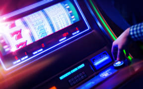 Casino Slot Machine Player Closeup Photo. Digital Slot Machine Spin. Playing in Las Vegas Concept Photo.