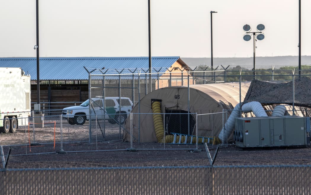 (FILES) In this file photo taken on June 21, 2019 a temporary facility set up to hold immigrants is pictured at a US Border Patrol Station in Clint, Texas. -