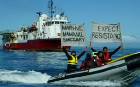 Protestors demonstrate before a prospecting vessel in Taranaki