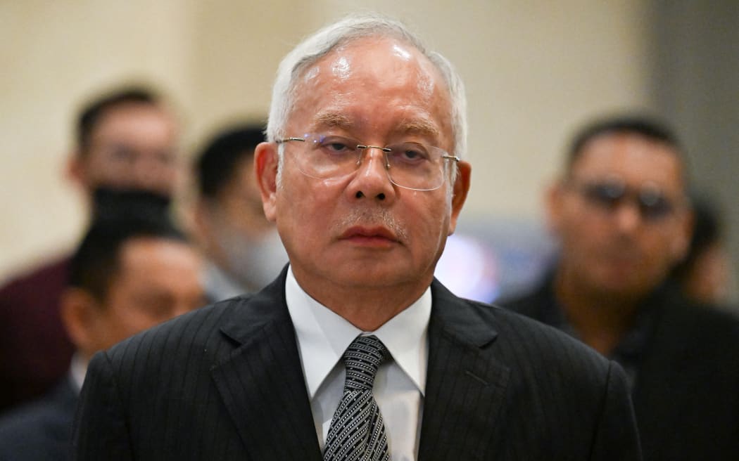 Malaysia's former prime minister Najib Razak arrives for a media conference at the federal court in Putrajaya, 16 August, 2022.