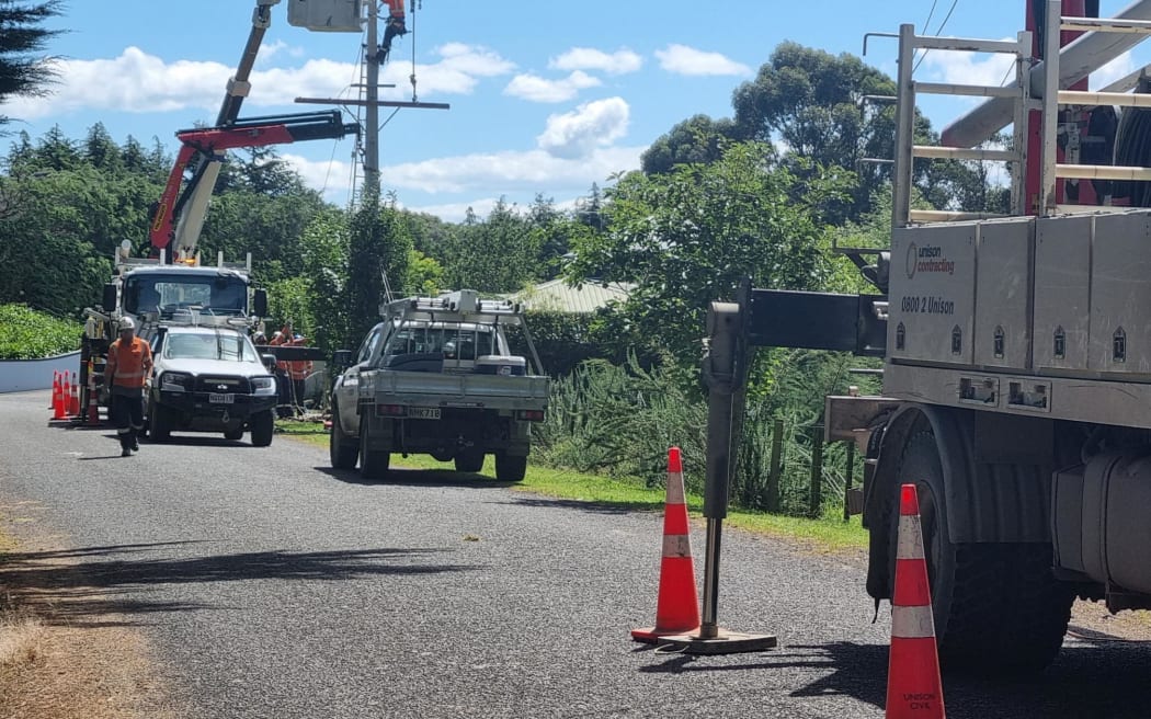 A lines repair crew on Pineleigh Drive, Poraiti, works to restore power to the Napier suburb.