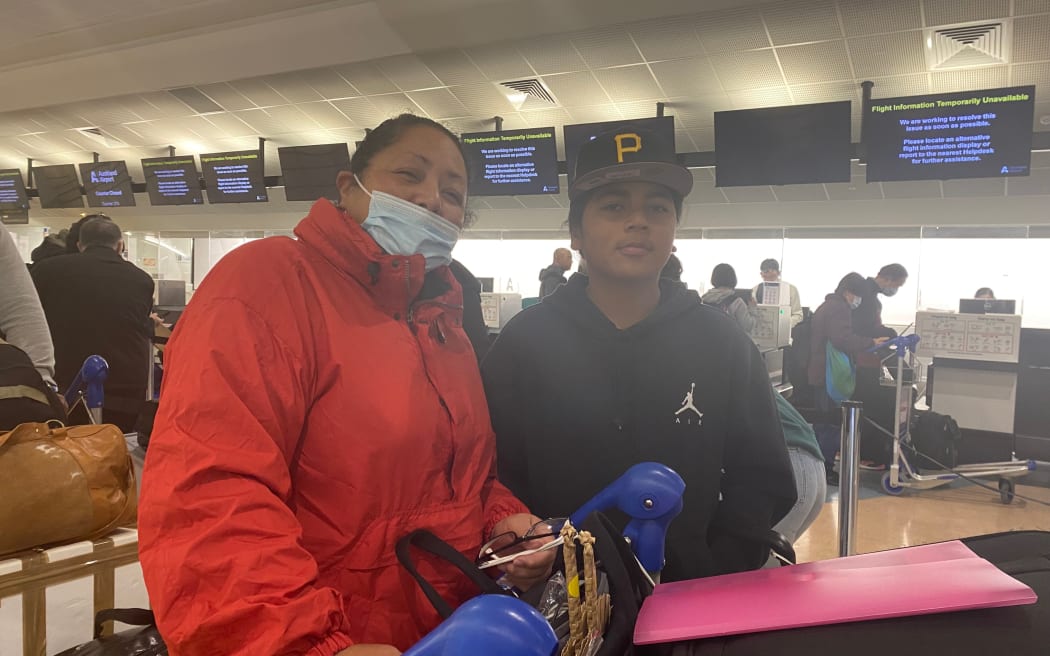 Sifa Togiataue and her son checking in at Auckland International Airport.