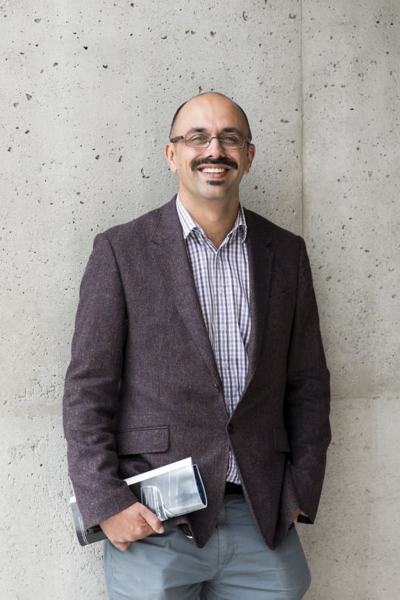 A portrait of journalist Ali Ikram.