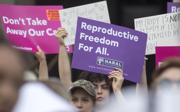 Protestors rally outside the Georgia State Capitol following the signing of legislation banning abortions once a foetal heartbeat.