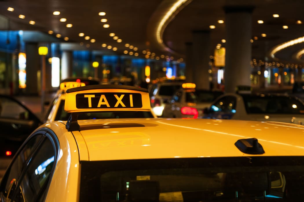 A file photo of a line of taxis at an airport