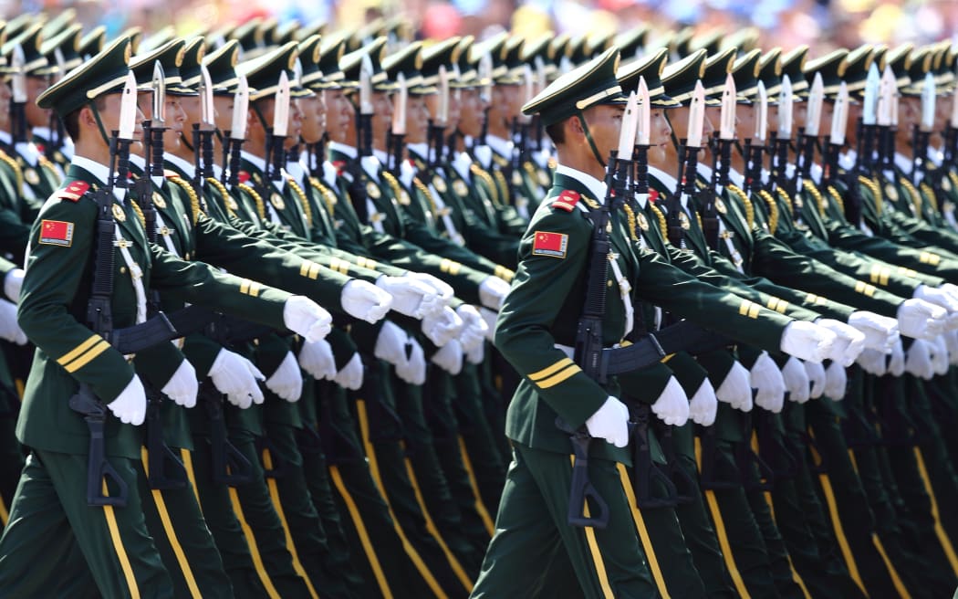 Chinese PLA (People's Liberation Army) soldiers march past the Tian'anmen Rostrum during the military parade to commemorate the 70th anniversary of the victory in the Chinese People's War of Resistance Against Japanese Aggression in Beijing, China, 3 September 2015.