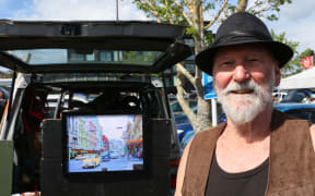 Martin Adlington at the Browns Bay Sunday market where he sells old photos.