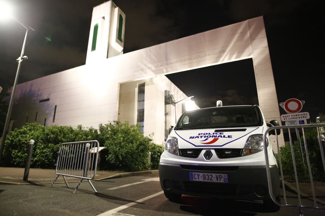 A police van stationed at a mosque in the Paris suburb of Creteil where a man tried to drive a car into a crowd.