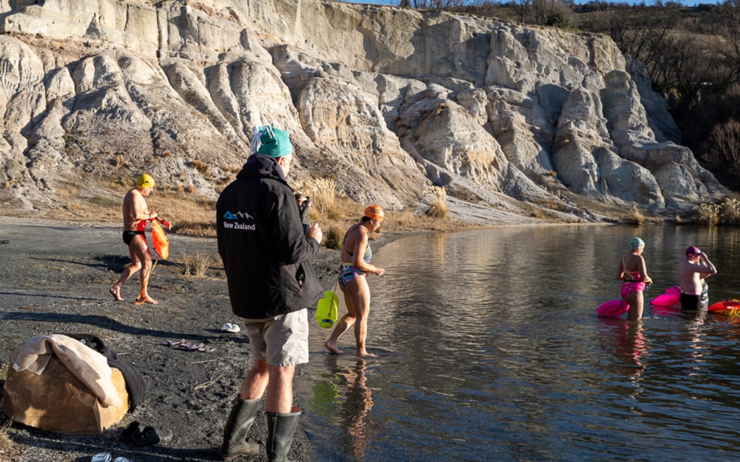 A winter dip: Swimmers prepare to plunge into freezing Otago lake