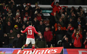 Liberato Cacace celebrates after scoring the opening goal for Wrexham in their third round FA Cup match against Nottingham Forest at Wrexham, January 9, 2026. (Photo by Oli SCARFF / AFP)