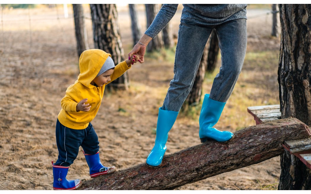 child on log with parent