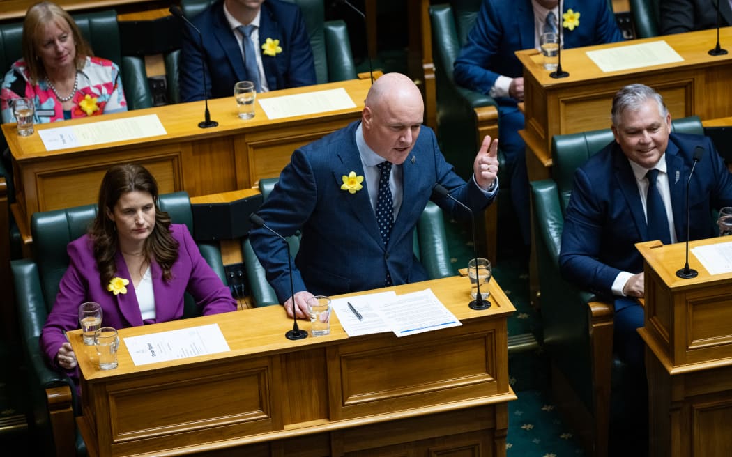 Christopher Luxon brings out his finger pistol to begin his duel with Chris Hipkins during Question Time.
