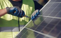 Worker and solar panels.