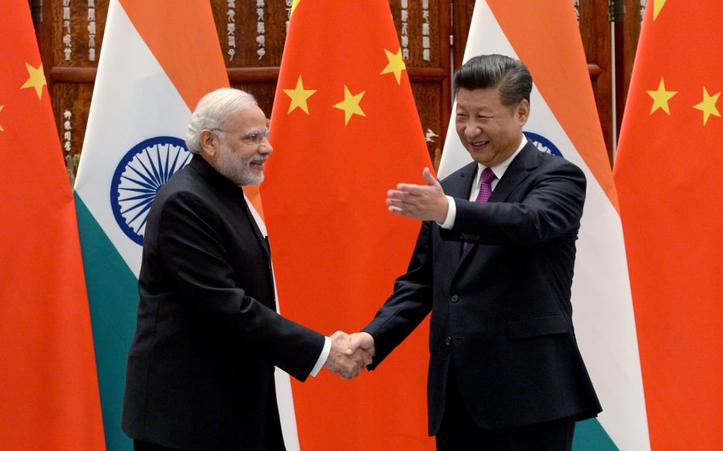 India Prime Minister Narendra Modi shakes hands with China President Xi Jinping at G20.