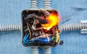 Damaged electrical junction box became cause of electrical short circuit and caused the electric wiring to ignition of fire.