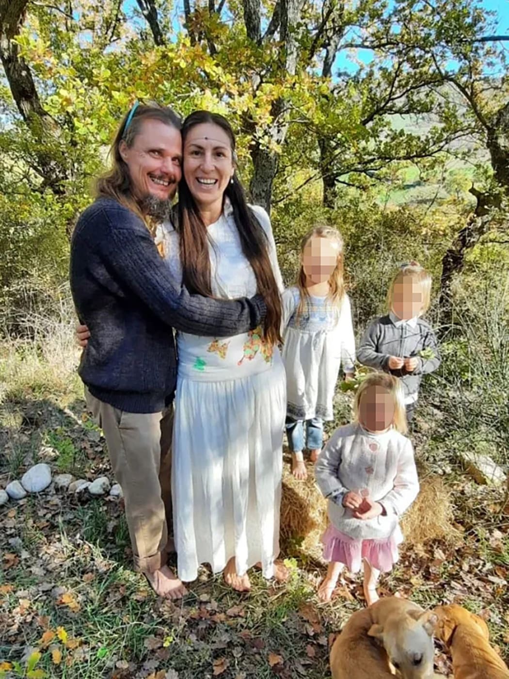 Nathan Trevallion and Catherine Birmingham pose for a picture with their children. A portion of this photo has been blurred by CNN to protect identities.