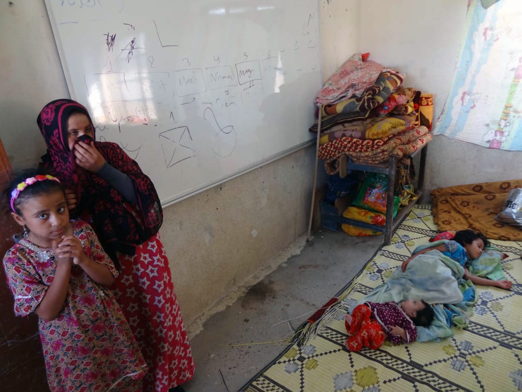 Displaced Iraqis who fled the violence  near Tikrit take refuge in a school in Cardagli Erkek, south of Kirkuk.