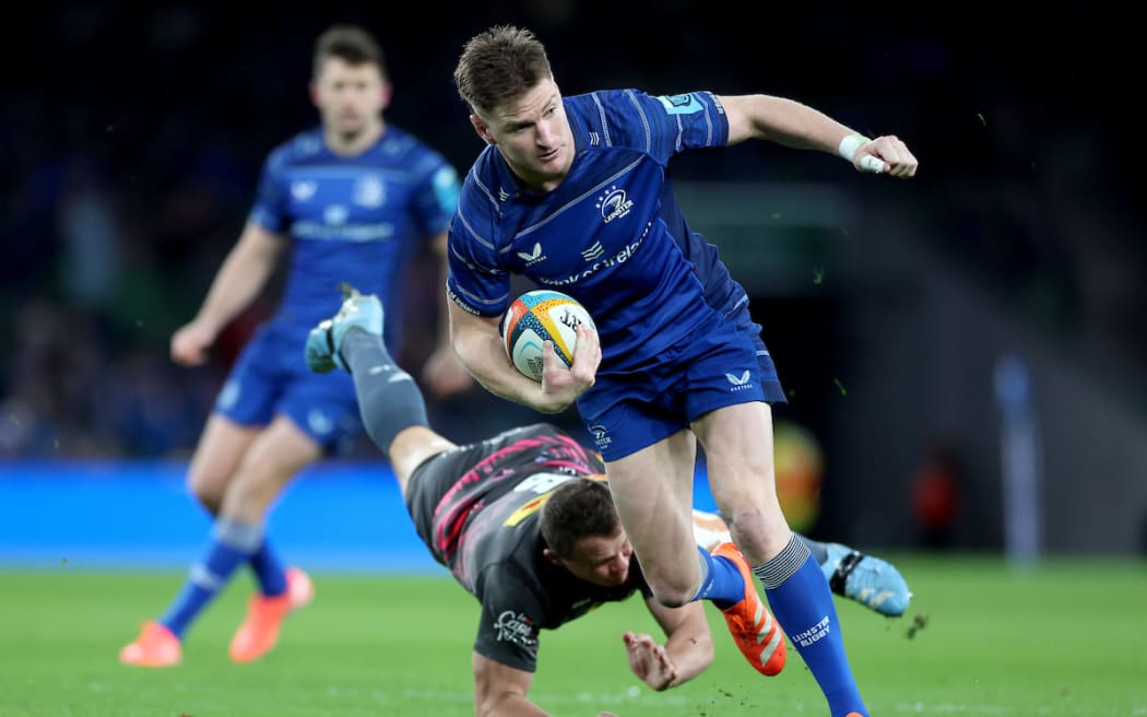 Jordie Barrett tackled by Deon Fourie.