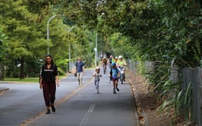 Pedestrians, scooter and bike riders on the northwestern cycleway.