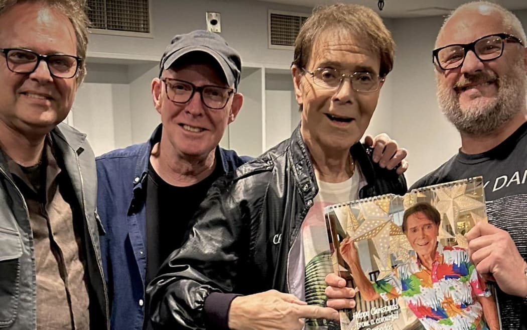 Nine to Noon's music correspondent Jeremy Taylor (far right) with Cliff Richard.
