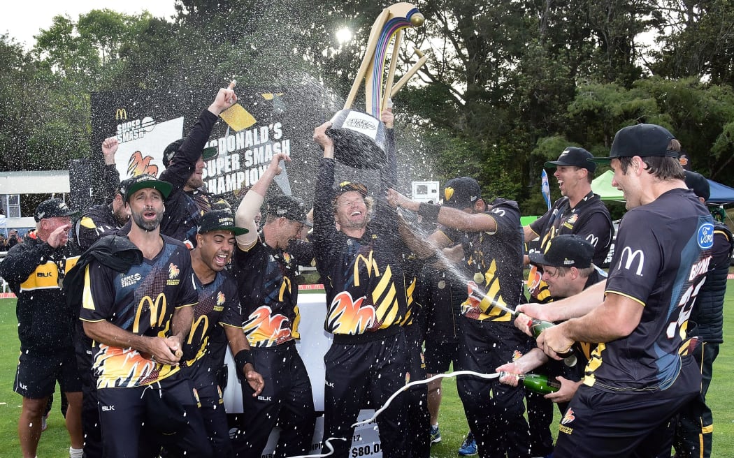 Firebirds captain Hamish Marshall lifts the trophy.