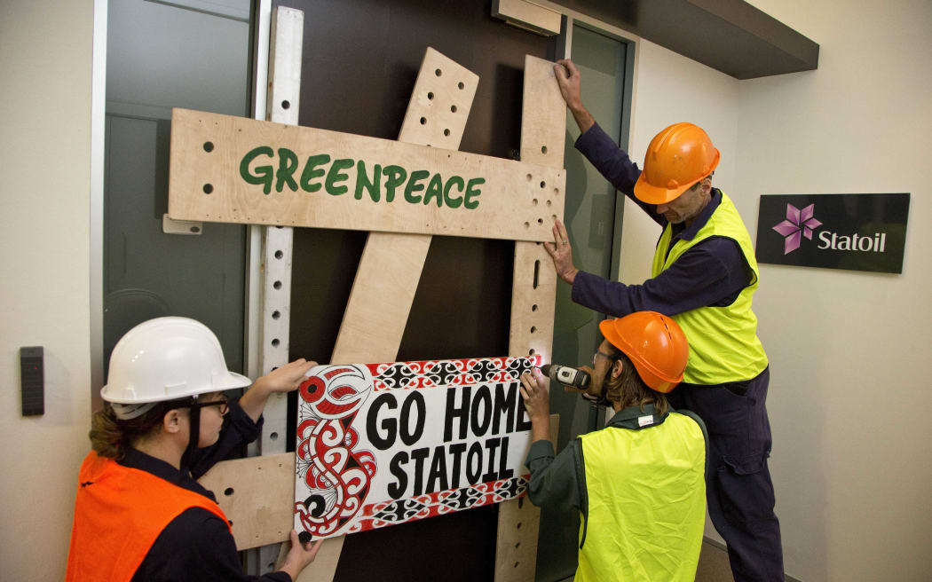 Greenpeace protesters at the Statoil energy company in Wellington this morning.