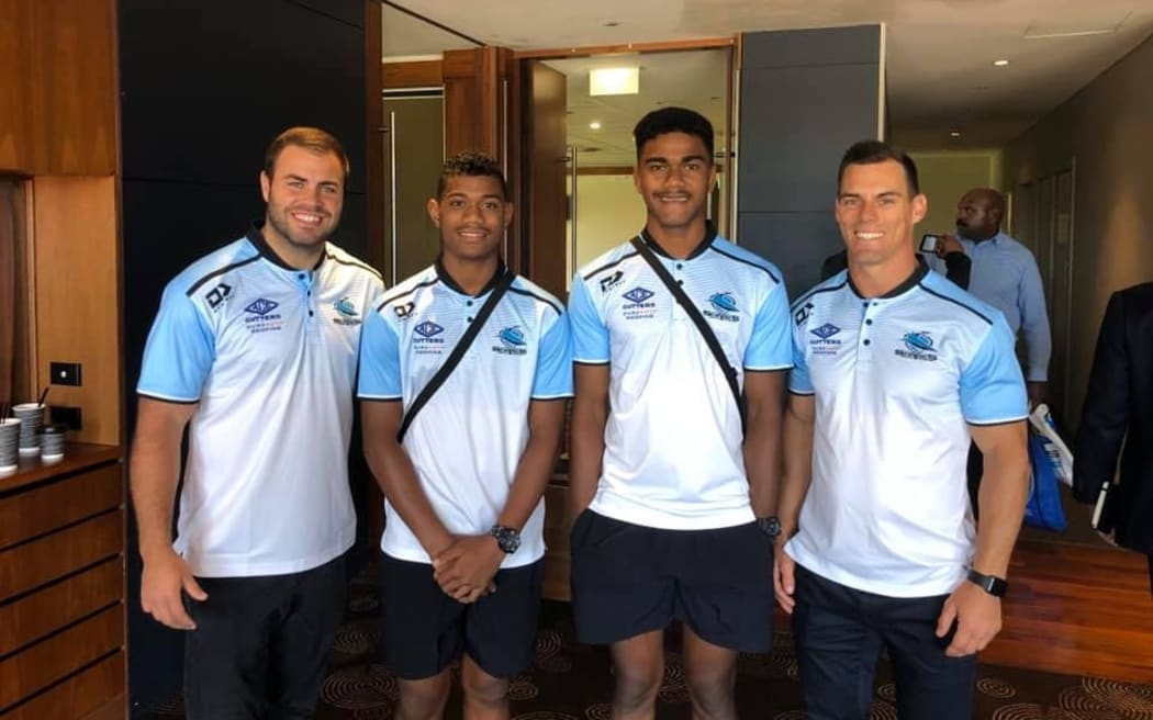 Cronulla's Sharks players Wade Graham (L) and John Morris with Sili and Kevu.