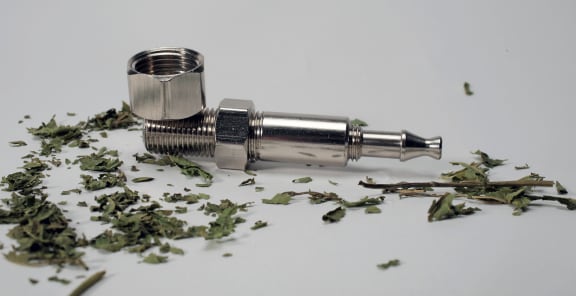 Synthetic cannabis and a pipe.