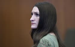 Defendant Lindsay Clancy looks toward the jury at the conclusion of Clancy's murder trial at the Plymouth County Superior Court in Plymouth, Massachusetts, on September 4, 2026. Judge William Sullivan declared a mistrial on Friday in the high-profile trial of an American woman who killed her three young children after a jury was unable to reach a unanimous verdict in a case that cast a spotlight on maternal mental heath. Lindsay Clancy, 36, acknowledged strangling Cora, five, Dawson, three, and Callan, eight months, but claimed she was suffering from postpartum psychosis, excusing her from criminal responsibility. After seven days of deliberations the 12-member jury was unable to reach unanimity, as required in criminal proceedings in the United States. A single juror opposed finding Clancy not guilty by reason of insanity. (Photo by Greg Derr / POOL / AFP)
