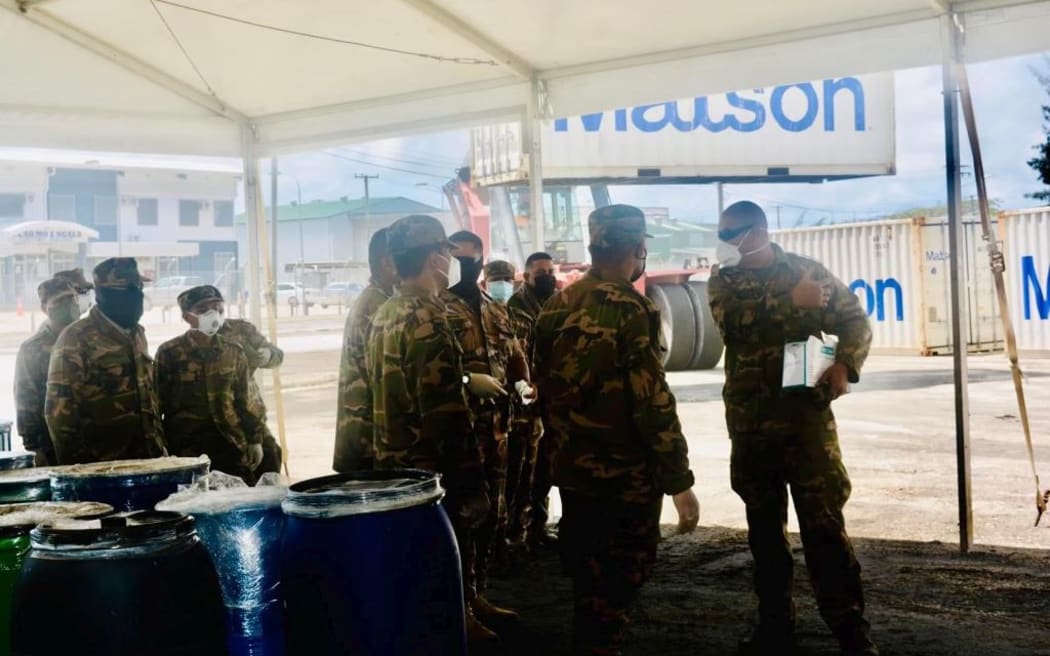 Tonga's army are unloading the containers that have arrived in Tonga.