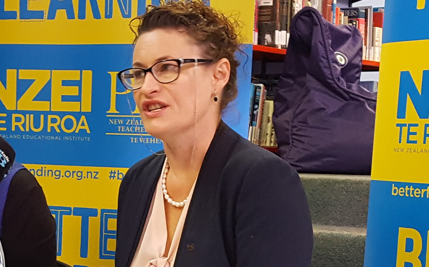 NZEI president Louise Green and PPTA president Angela Roberts announce the results of a vote in which teachers overwhelmingly opposed a proposed change to school funding.