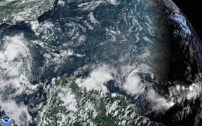 Hurricane Beryl (centre right) can be seen in this US National Oceanic and Atmospheric Administration satellite image taken at 4:20pm EDT on Saturday 29 June, 2024, as it heads toward the Caribbean.
