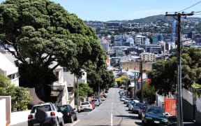 14301140 - wellington, new zealand - street with cars parked alongside