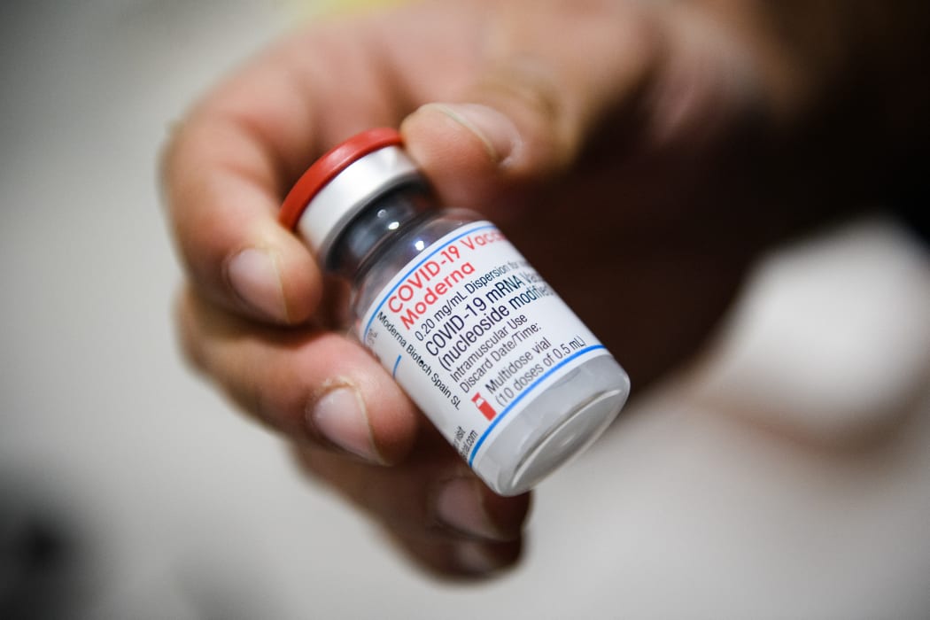 A nurse holds a vial of Moderna Covid-19 vaccine in a social center of La Gavotte Peyret popular neighbourhood, in Septeme-Les-Vallons, near Marseille, on January 12, 2022.