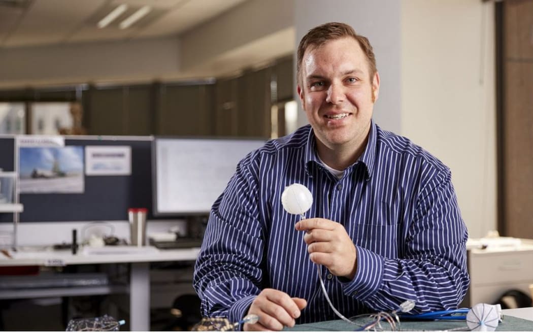 Tim Angeli-Gordon with the endoscopic gut sensor device.