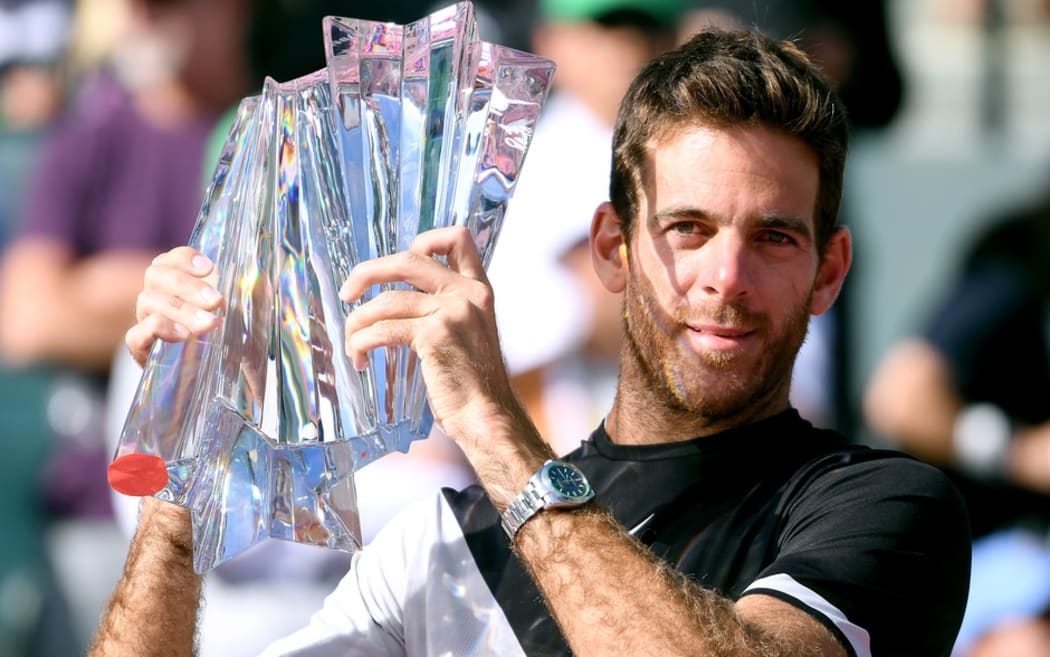 Juan Martin del Potro lifts the Indian Wells trophy for the first time.