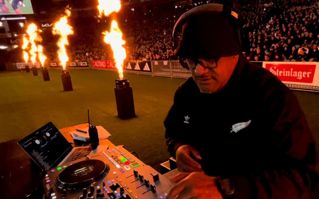 DJ Al’Goodie behind decks at an All Blacks game in July 2024.