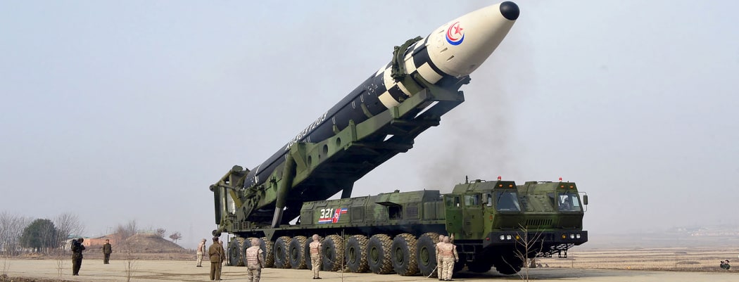 This picture taken on March 24, 2022 and released from Korean Central News Agency on March 25, 2022 shows what state media reports as a new type inter-continental ballistic missile (ICBM), the Hwasongpho-17 in an undisclosed location in North Korea.