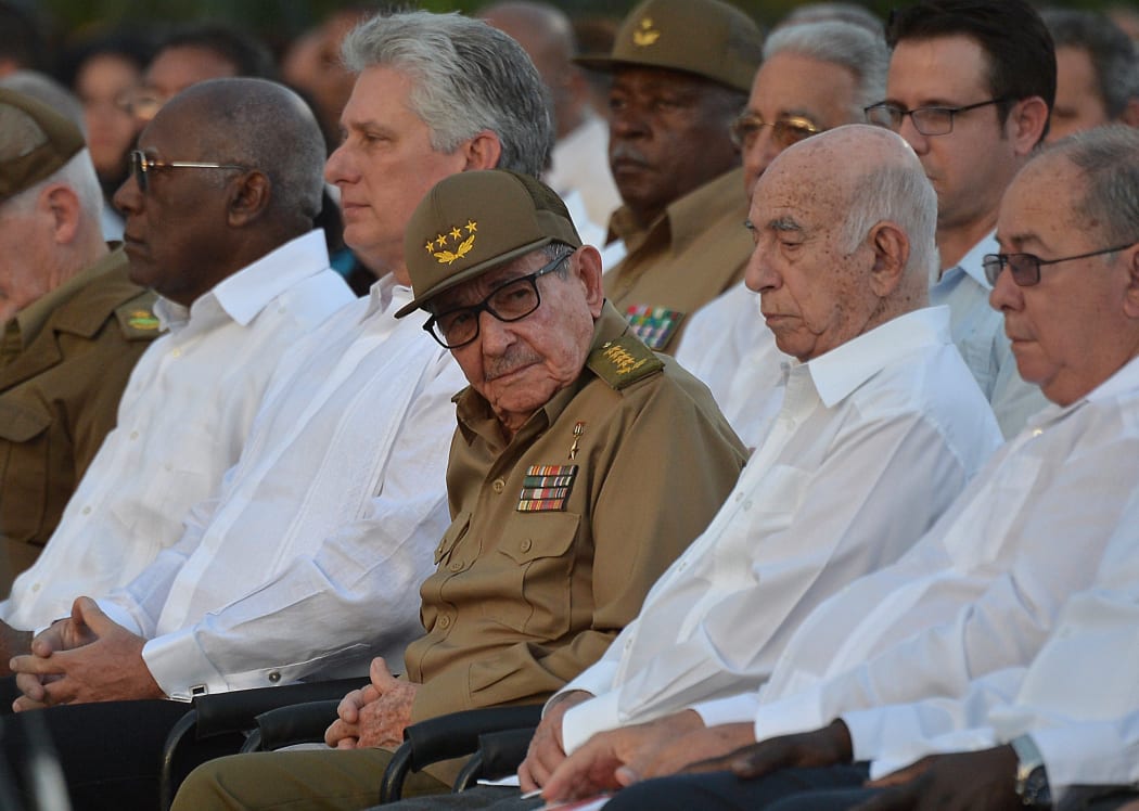 Raul Castro and President Miguel Diaz-Canel (second from left) take part in the celebration of the 60th anniversary of the Cuban revolution at the Santa Ifigenia Cemetery in Santiago de Cuba.