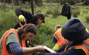 The SALSA team at work. Ash & Olivia build the solar panel while John & Finn start digging.