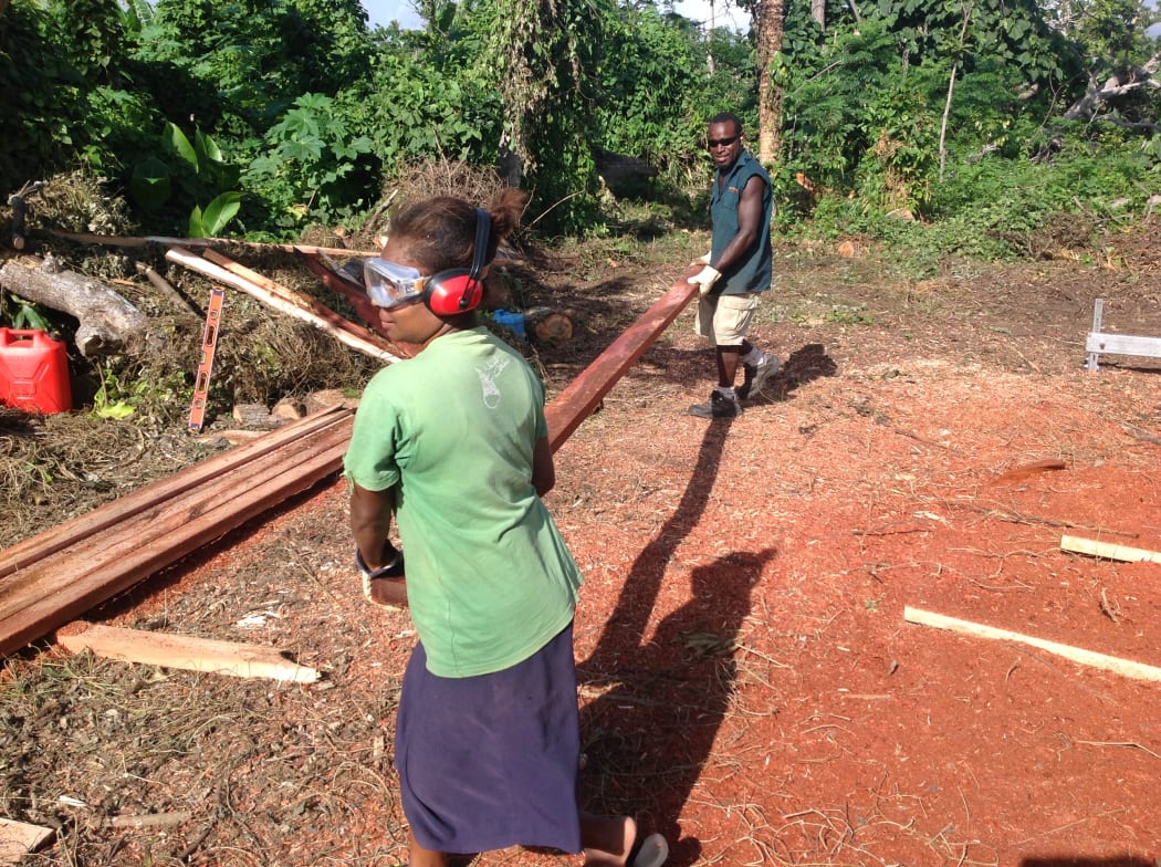 Villagers on Tanna Island in Vanuatu learn to mill their own timber as part of the cyclone rebuild.