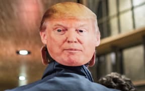 Man in Trump mask.