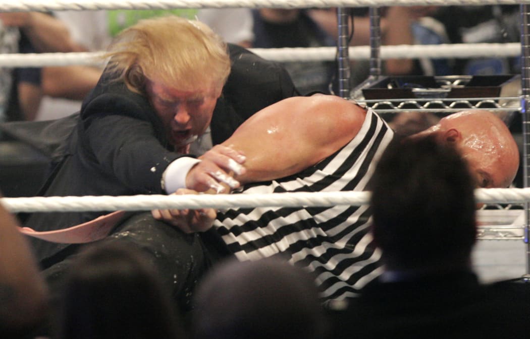 Mr Trump gets taken to the mat by 'Stone Cold' Steve Austin after the the Battle of the Billionaires in 2007.