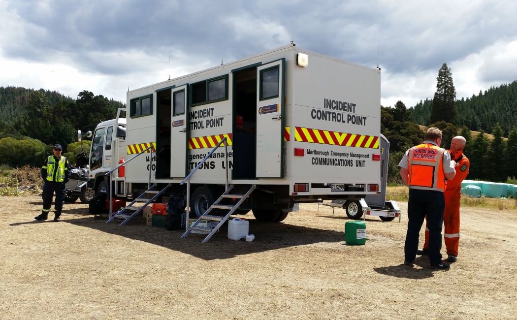 Richard McNamara and Rich Law, from the Blenheim rural fire force, in front of the incident control point.