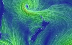 Strong winds, heavy rain loom as a tropical low nears New Zealand.