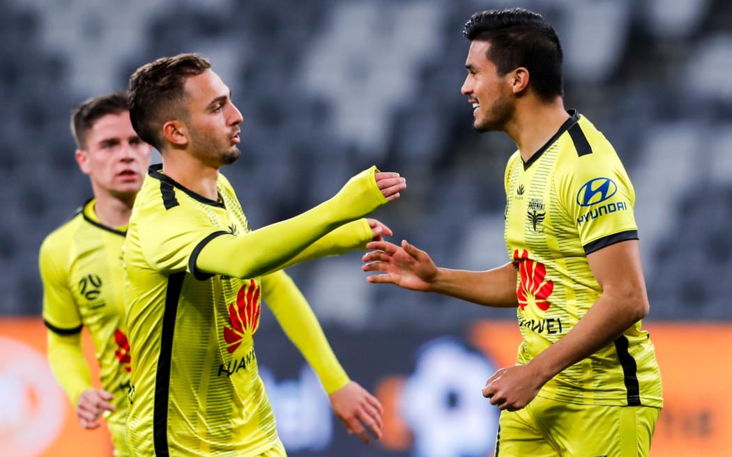 Ulises Davila of the Phoenix celebrates with teammates after scoring during the A-League match,  Perth Glory v Wellington Phoenix at Bankwest Stadium, Wednesday 22nd July 2020 Copyright Photo: David Neilson / www.photosport.nz