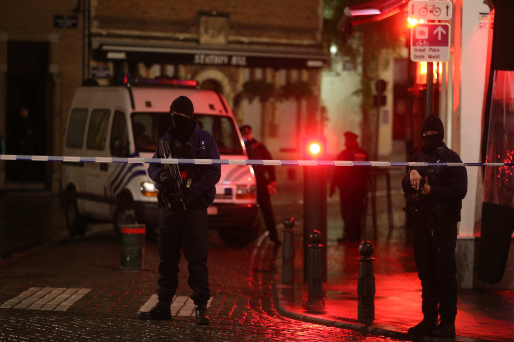 Belgian police officers secure an area in Brussels on Sunday,