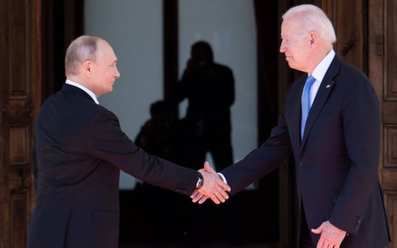 Russian President Vladimir Putin shakes hands with US President Joe Biden prior to the US-Russia summit in Geneva on 16 June 2021.